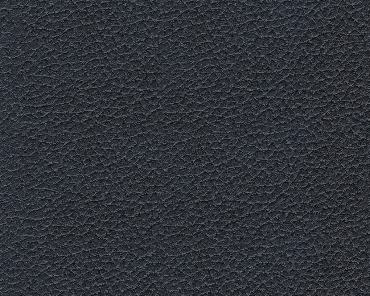 Black textured faux leather upholstery close-up