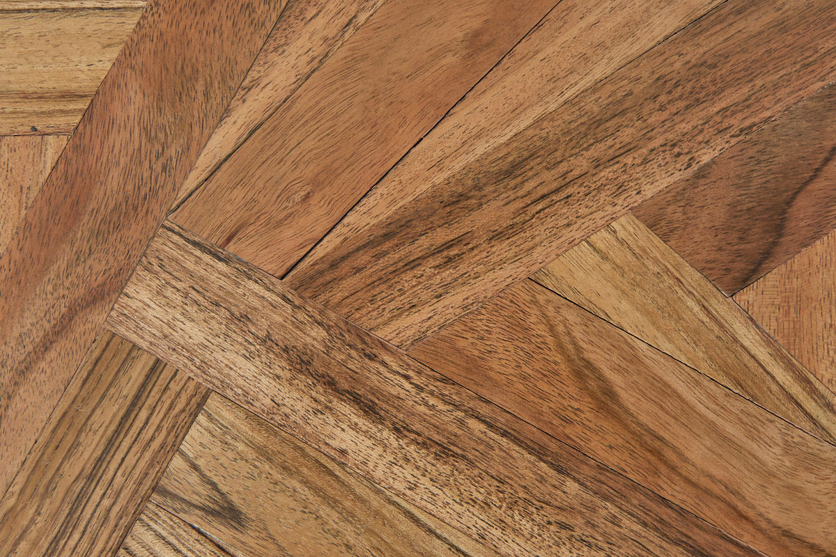 Close-up of patchwork wood grain pattern on wooden box lid