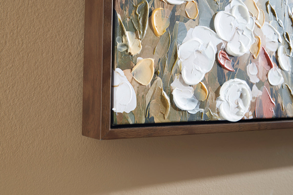 Textured framed wall art with raised white and gold floral petals