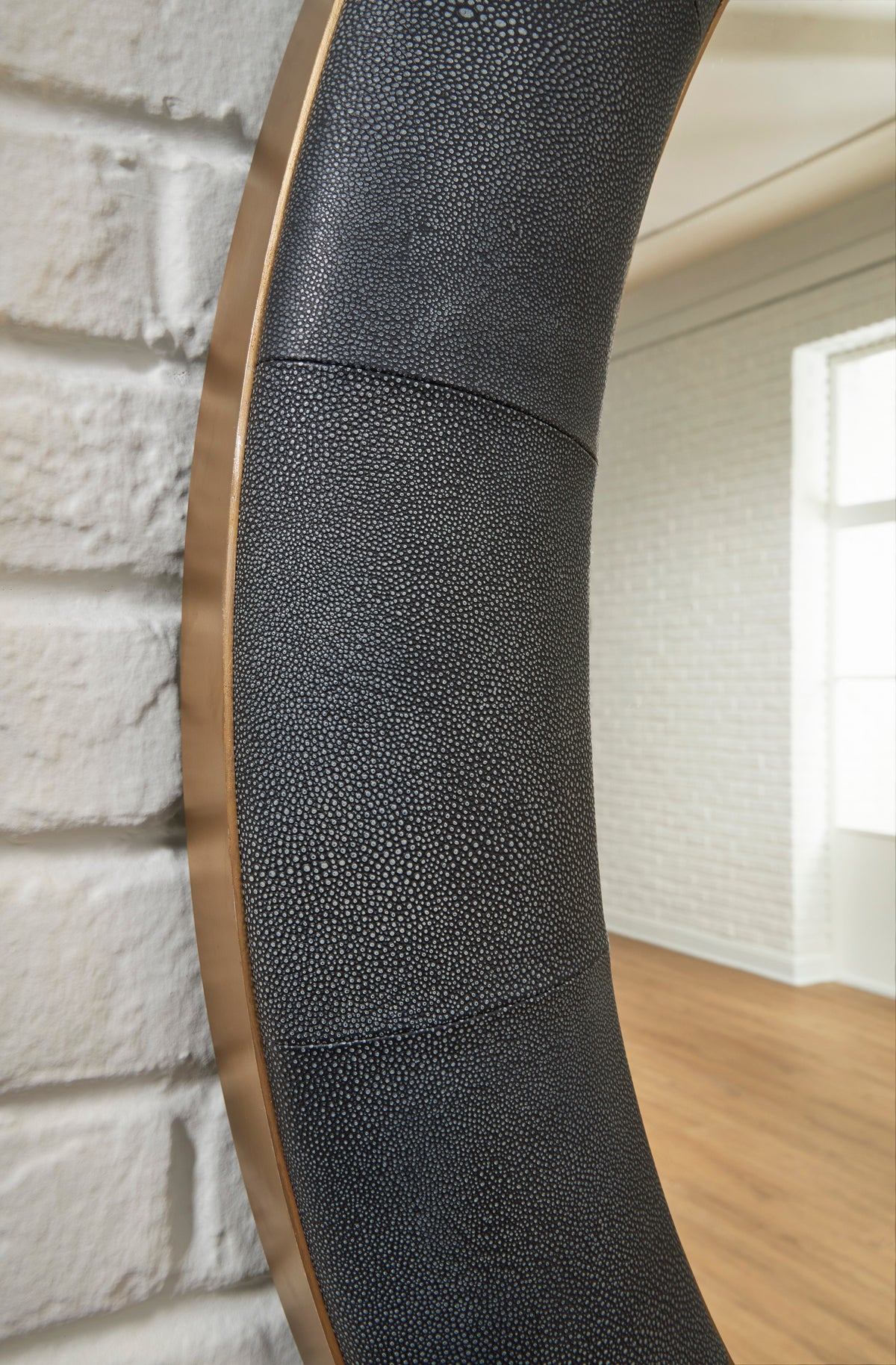 Tall mirror frame close-up with black textured finish and warm wood border