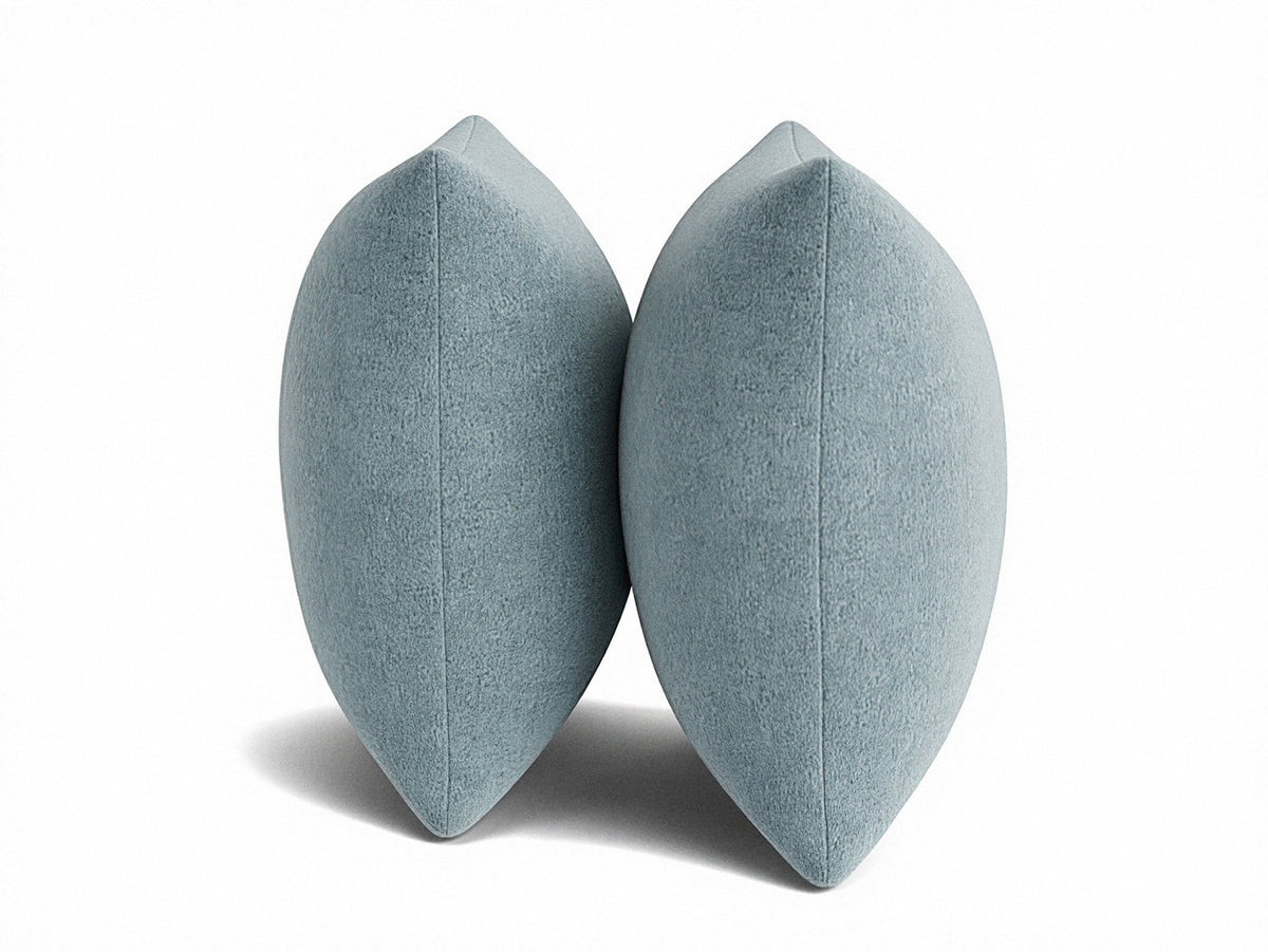Pair of light blue 22" knife-edge throw pillows, showing tapered side profile