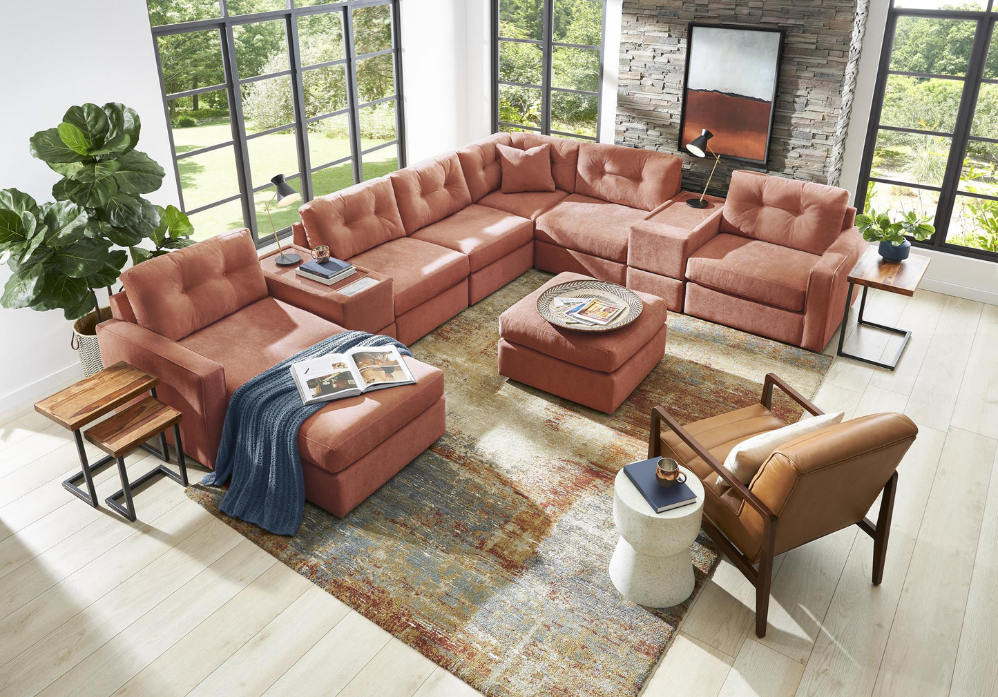 Terracotta L-shaped sectional sofa with tufted cushions and matching ottomans