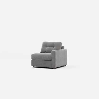 Gray upholstered modular chair, angled view showing tall back and armrests