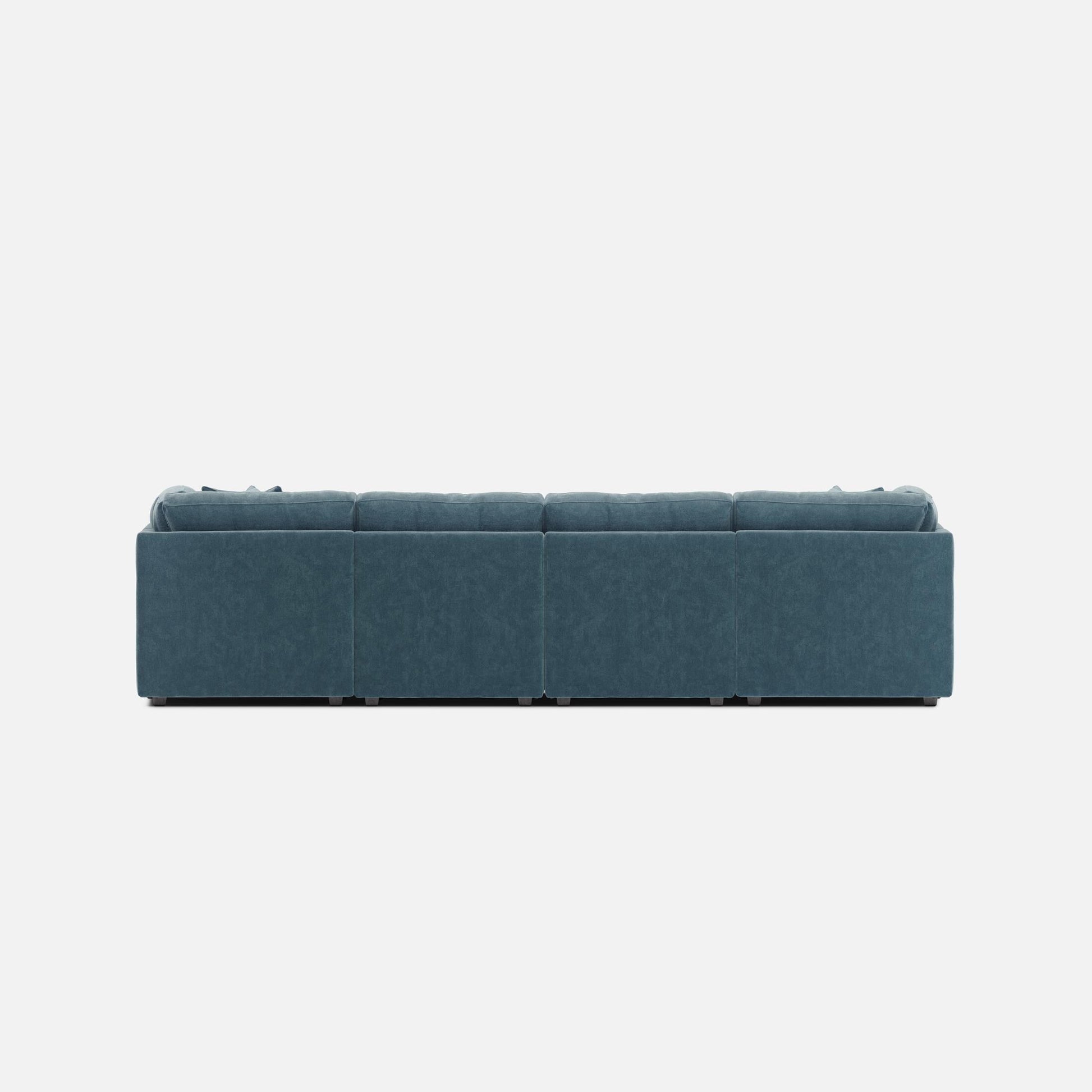 Teal modular sectional sofa with long bench seating and tufted cushion back