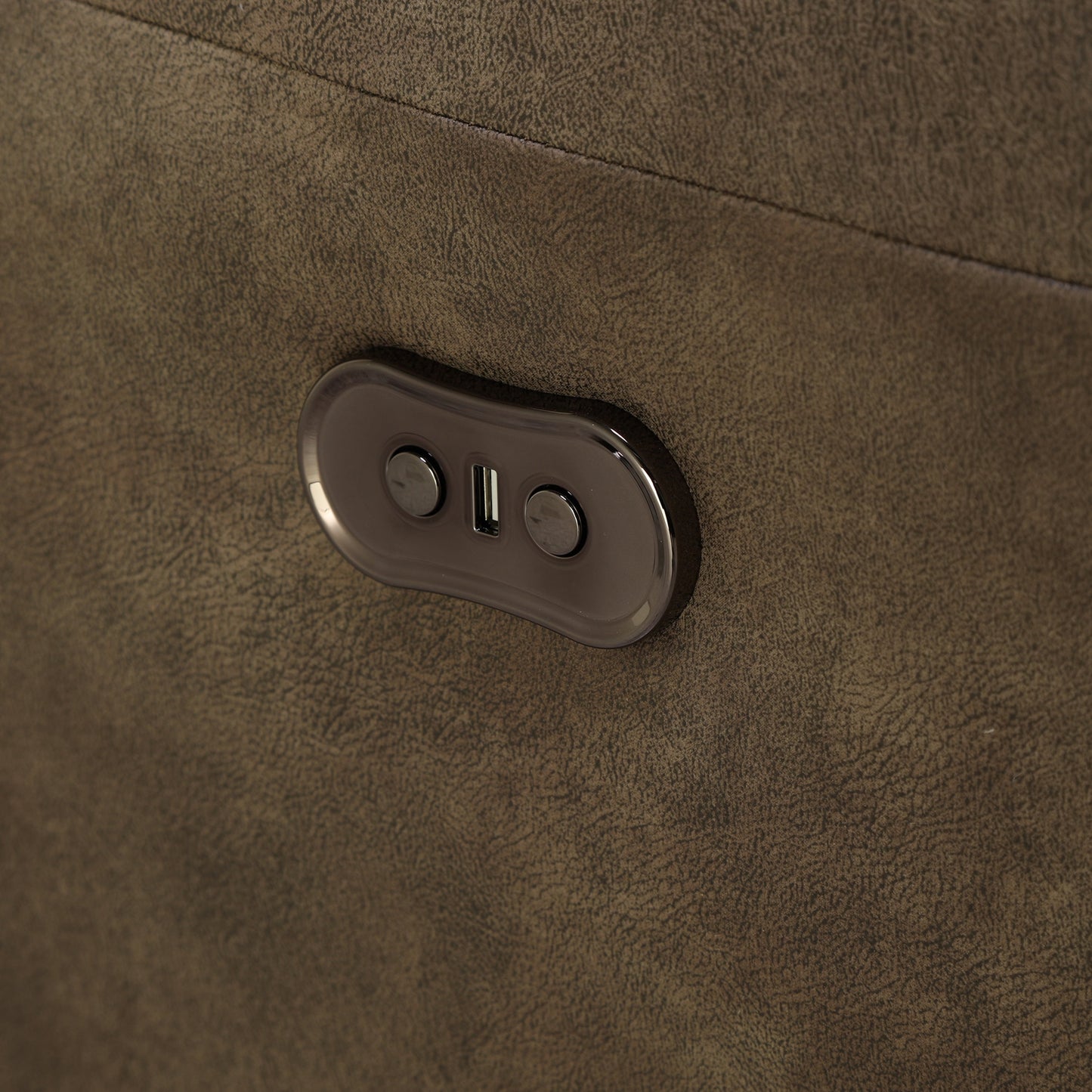 Dark brown loveseat arm control panel with two buttons on oval housing