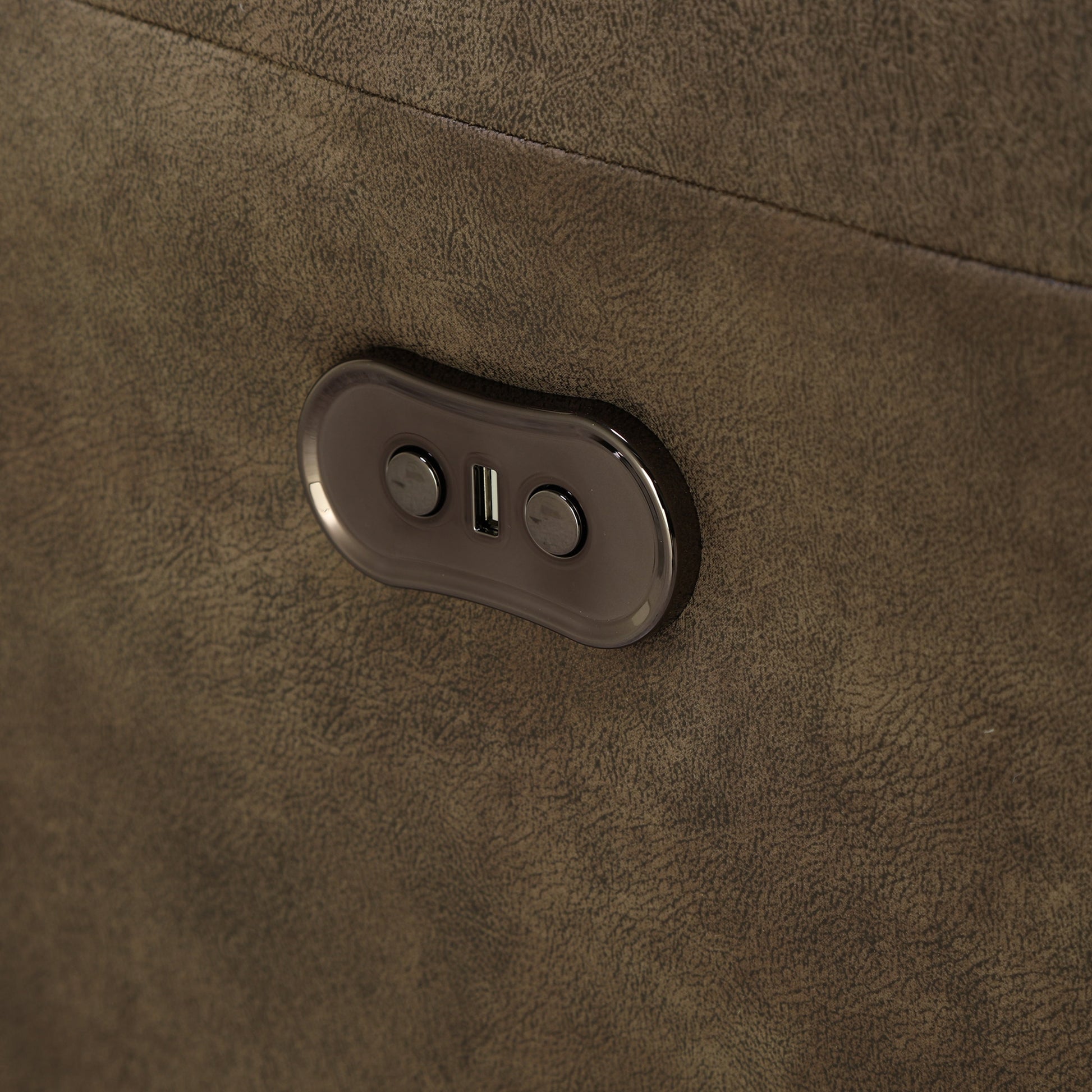 Dark brown loveseat arm control panel with two buttons on oval housing