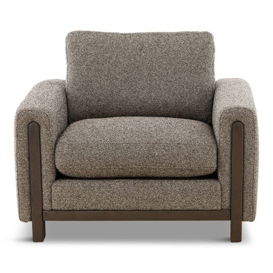 Light gray upholstered armchair with tall back cushion, padded seat, and wooden legs