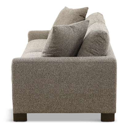 Gray fabric sofa back and seat with three cushions and dark wood legs.