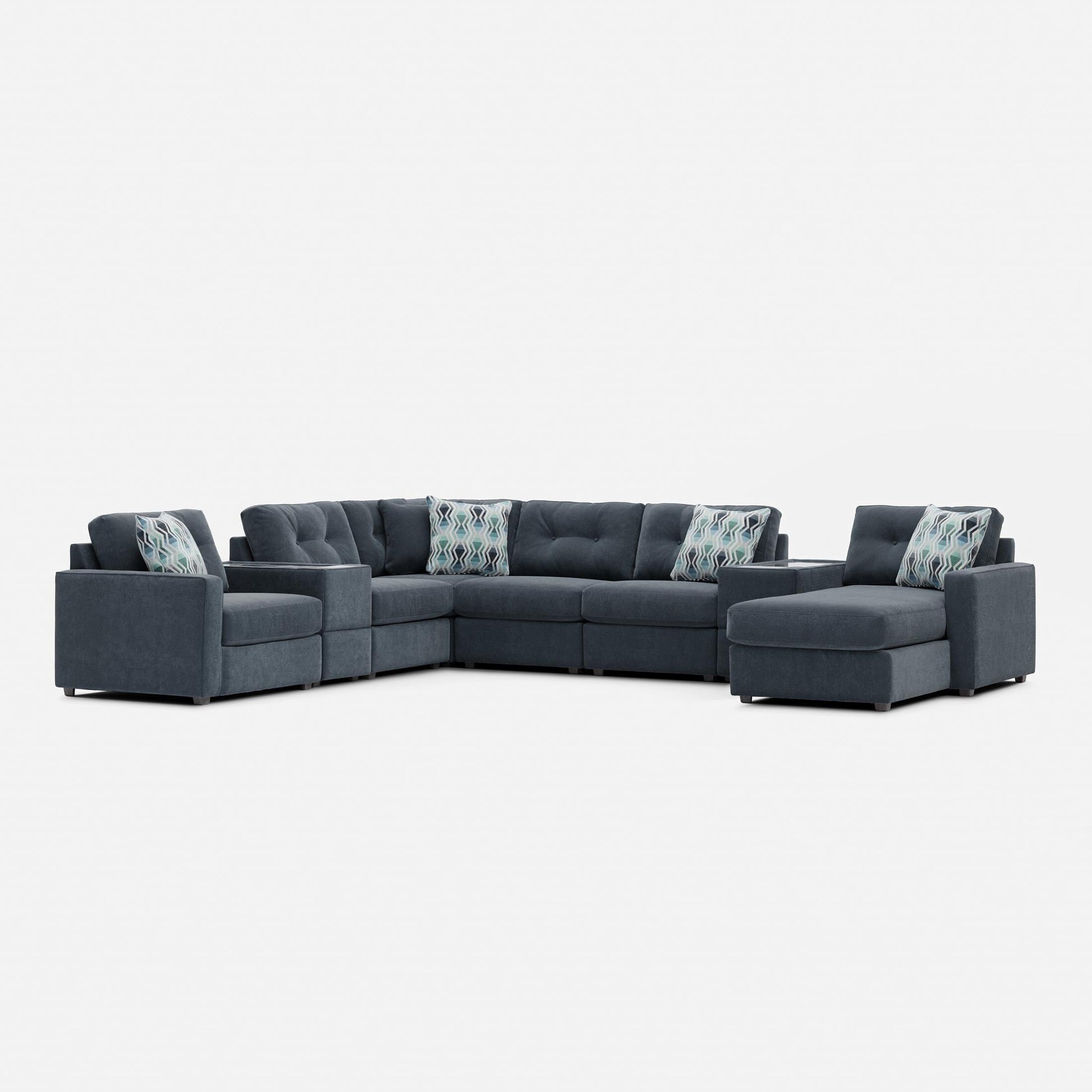 Gray modular sectional sofa with patterned lumbar pillows and corner chaise seating