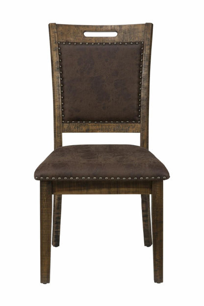 Upholstered dining side chair with dark seat cushion, studded back, wooden legs