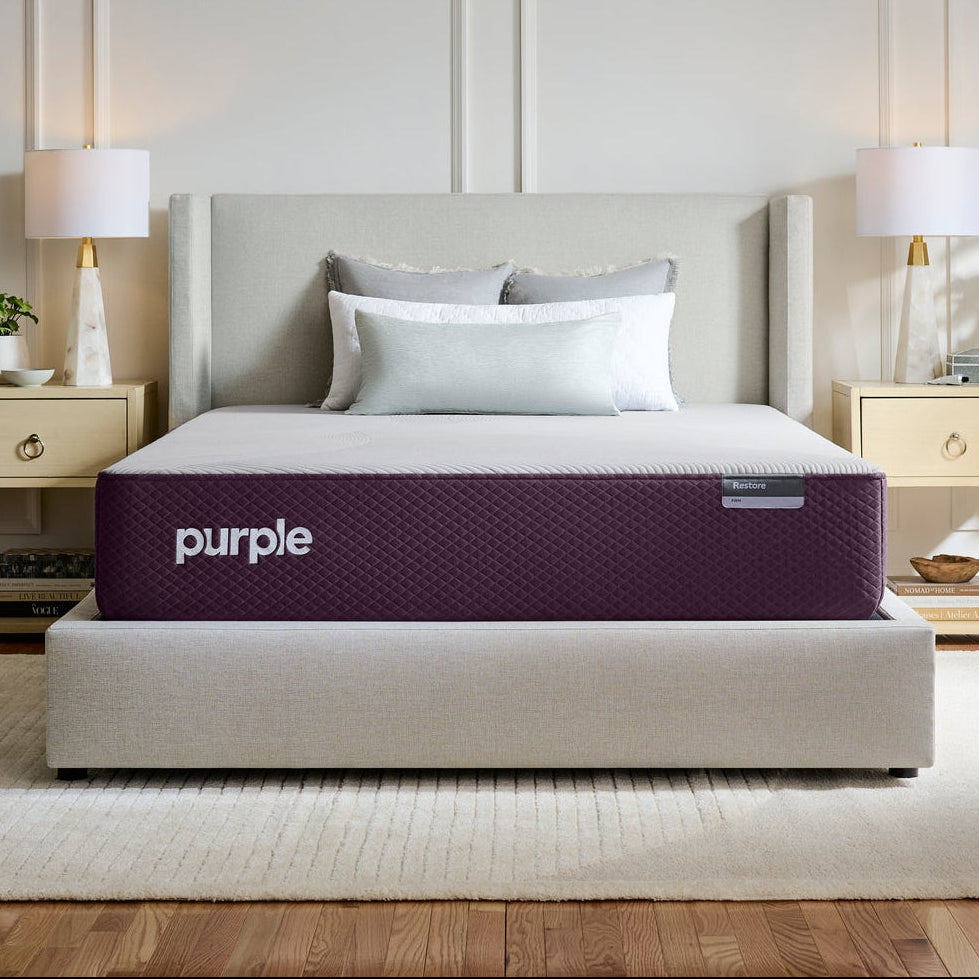 Purple mattress on a bed in a bedroom setting