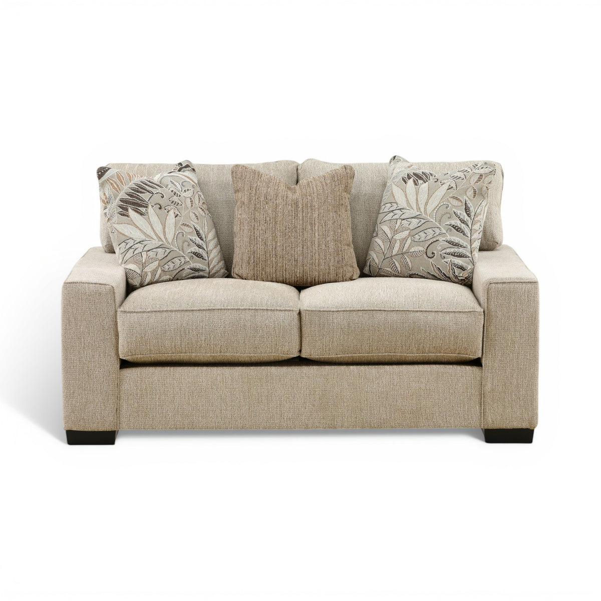 Troy loveseat in light beige fabric with two patterned accent pillows and rounded arms
