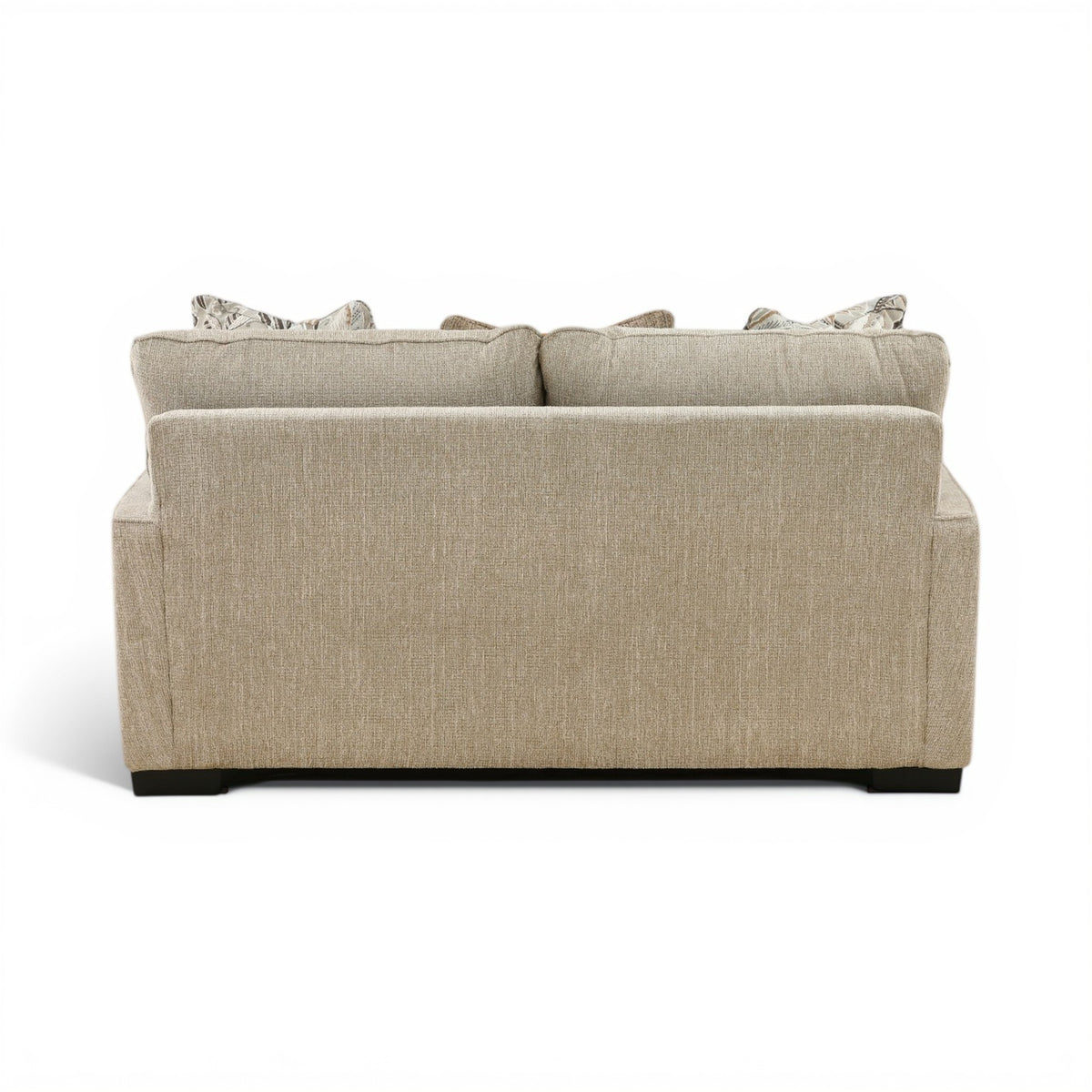 Light beige loveseat rear view with back cushion seams and stacked accent pillows