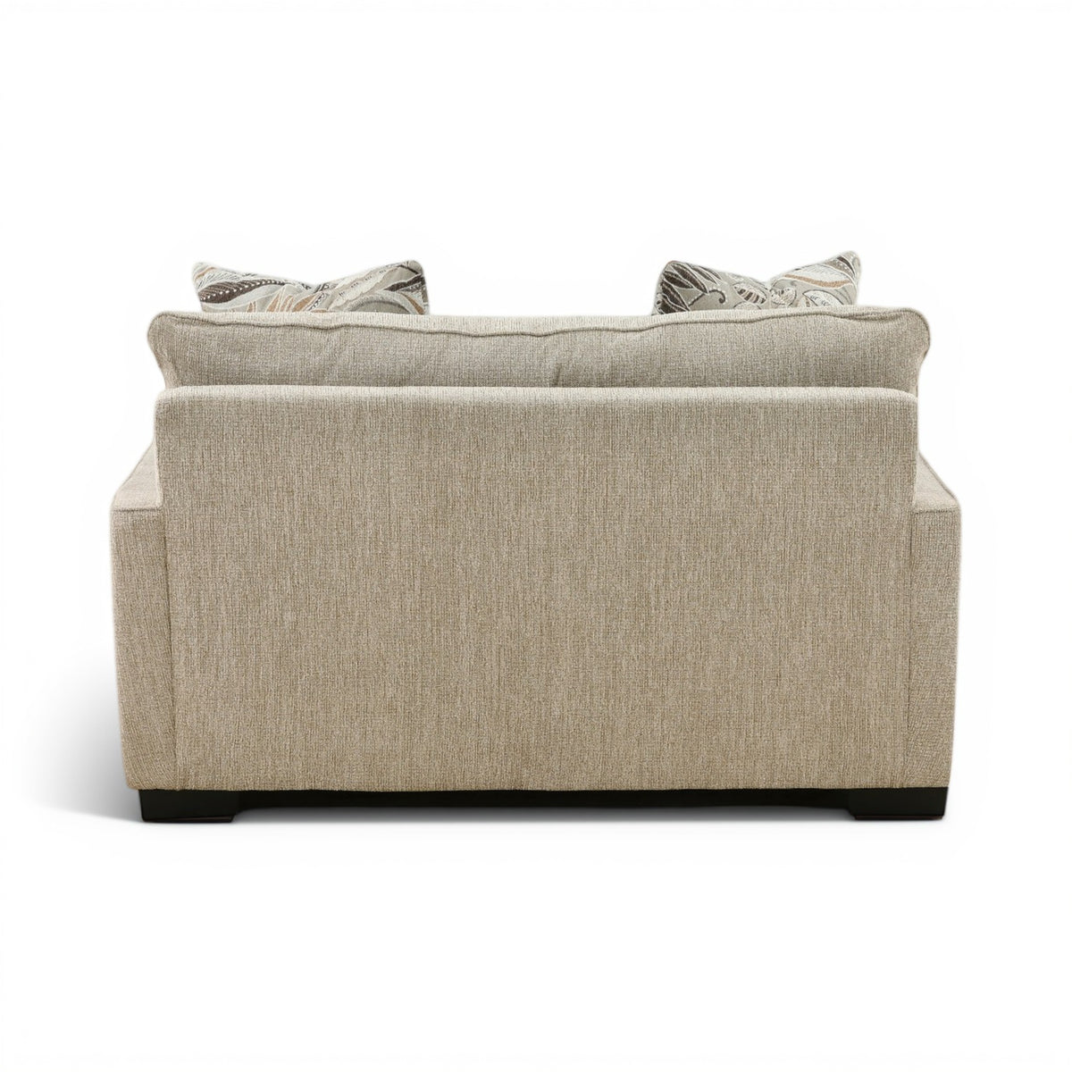 Beige upholstered loveseat chair with wide back and two throw pillows