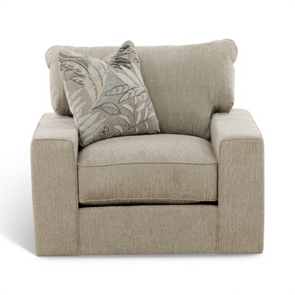 Beige upholstered swivel chair with seat cushion and patterned leaf accent pillow