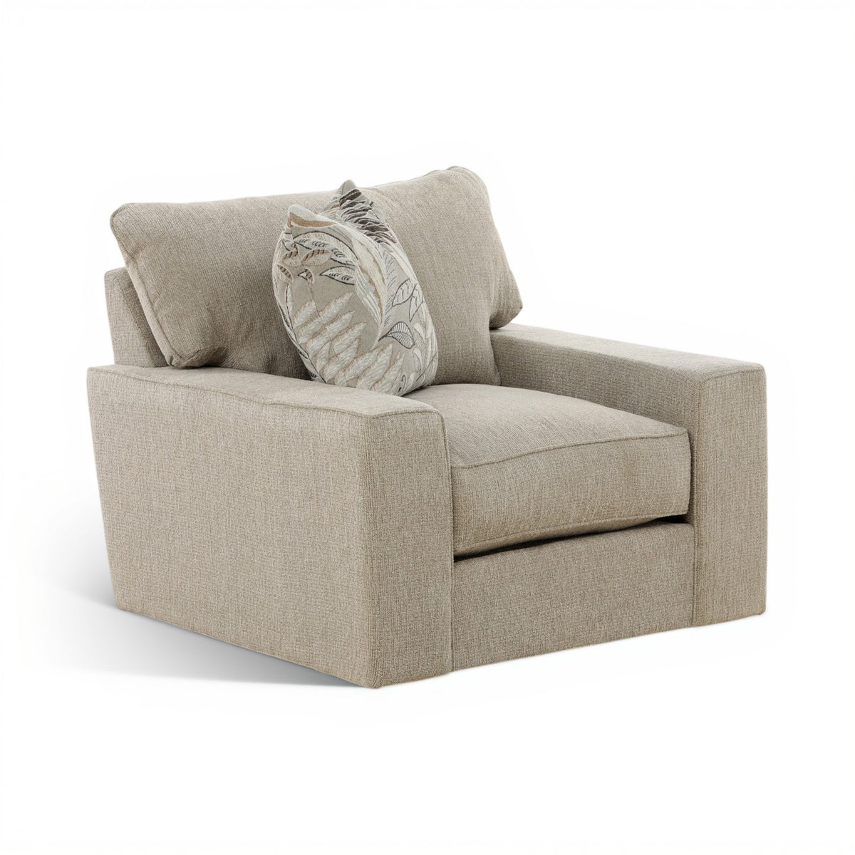 Beige upholstered swivel chair with wide arms and patterned leaf throw pillow