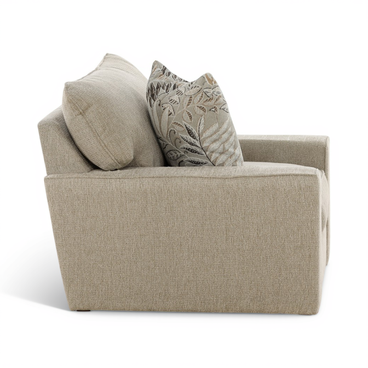 Beige upholstered swivel chair with back cushion and leaf-pattern accent pillows