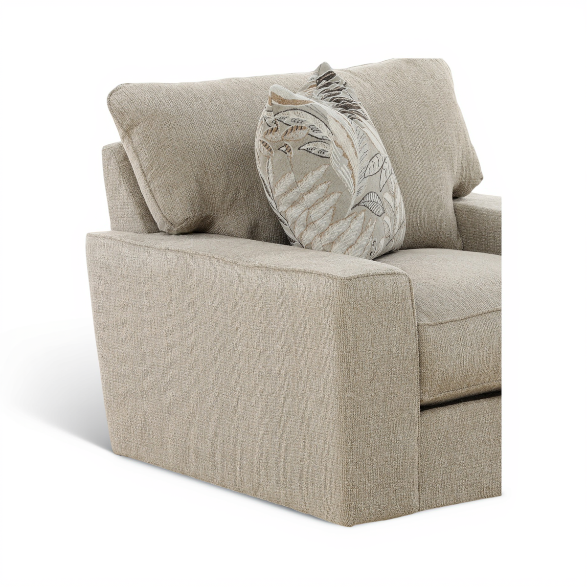 Beige upholstered swivel chair with arms, seat cushion, and leaf-pattern accent pillow