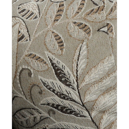 Close-up of leaf-pattern accent pillow fabric in beige, gray, and dark tones