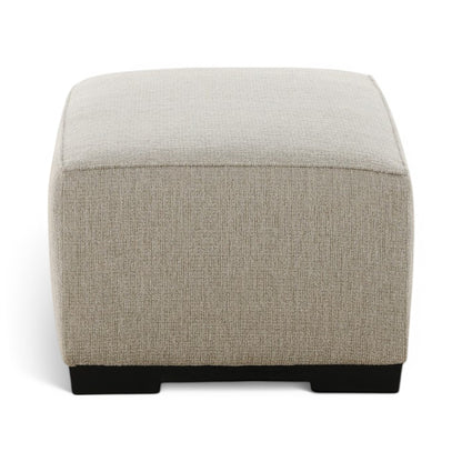 Upholstered ottoman in light beige fabric with curved top and black base