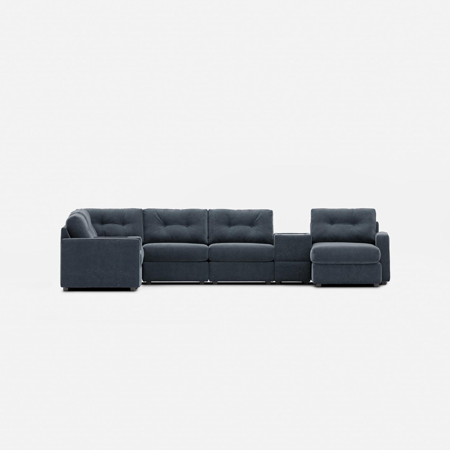 Dark gray modular sectional sofa with tufted back cushions and padded armrests