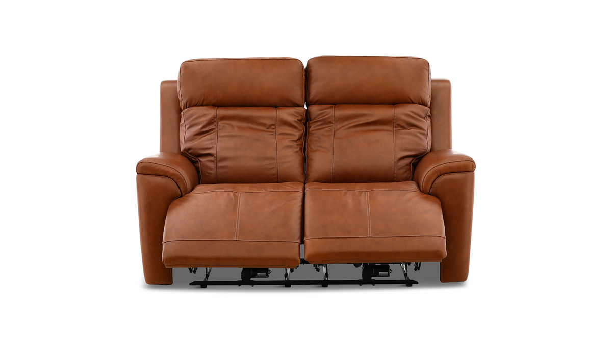 A two-seater power reclining leather loveseat in a warm cognac brown color, shown from the front against a solid white background.