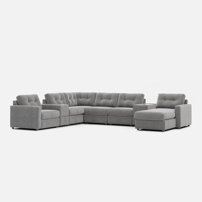 Gray L-shaped modular sectional sofa with deep tufted back and padded arm cushions