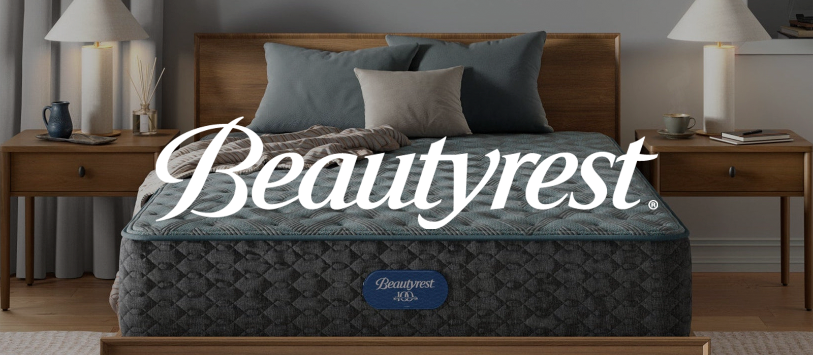 Beautyrest mattress in a bedroom setting with wooden headboard and nightstands and Beautyrest logo on top