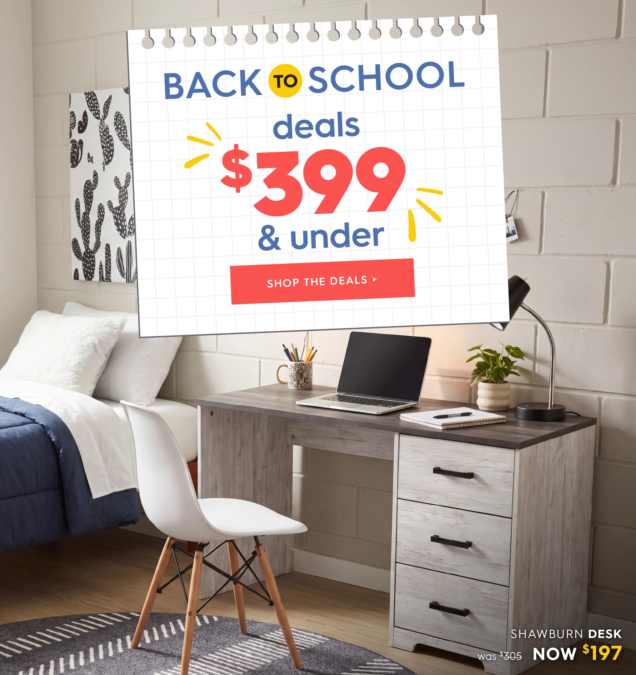 A bedroom scene showing a gray and white wood twin-over-one desk with three drawers, styled with a white chair, laptop, mug, and plant. A large promotional sign reading 'BACK TO SCHOOL deals $399 & under' is overlaid on the scene, with 'SHAWBURN DESK' and pricing text in the lower right corner. Shop the deals.