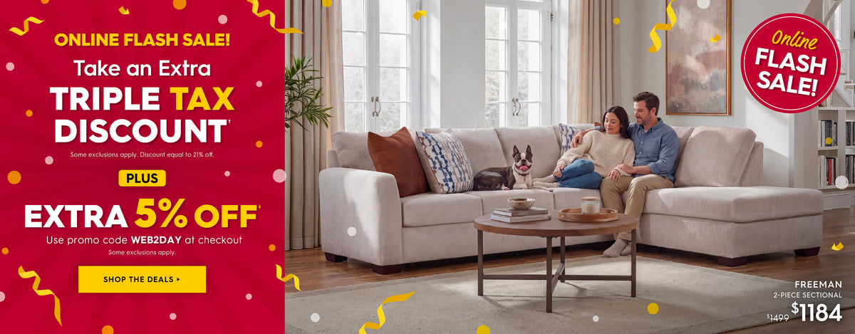 A promotional banner for a light beige sectional sofa in a bright living room, featuring a couple sitting on the sofa with a dog on a cushion. The left side has a large red promotional panel with text that says "Online flash sale! Taken an extra triple tax discount. some exclusions apply. discount equal to 21% off. Plus Extra 5% off. Use promo code WEB2DAY at checkout. Some exclusions apply. Shop the deals."