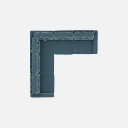 Teal L-shaped modular sectional sofa with tufted backrest and padded corner arm.