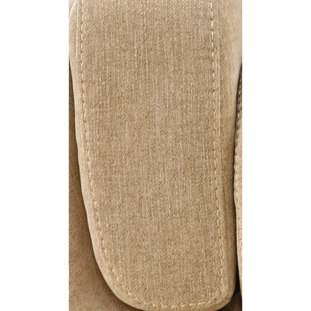 Sand upholstered armrest fabric texture with visible stitching on loveseat
