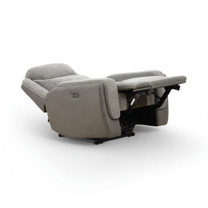 Grey power recliner reclined position with exposed base mechanism and extended foot platform.