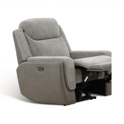 Grey power recliner chair angled view showing open base and extended footrest
