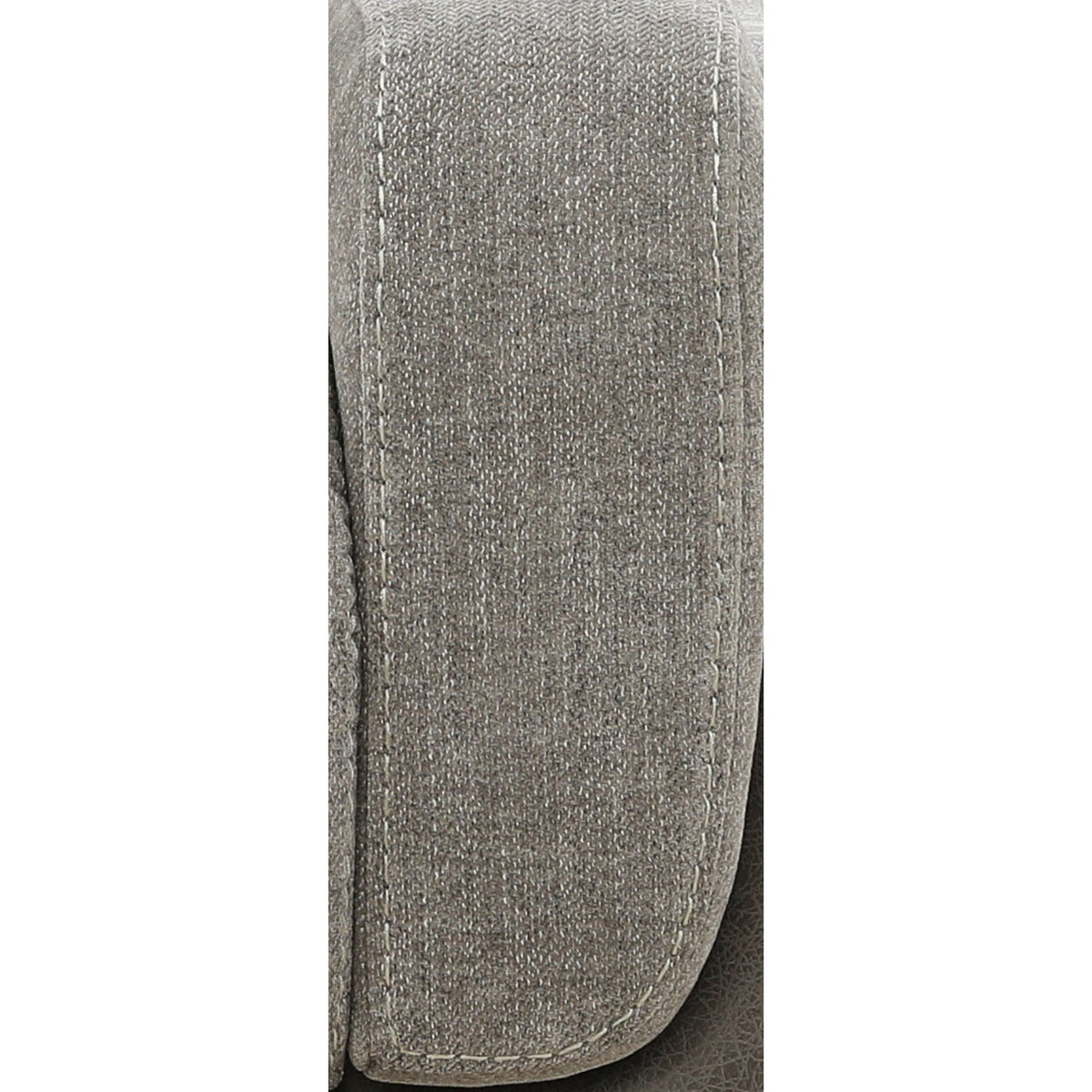 Textured upholstery armrest end with contrast stitching