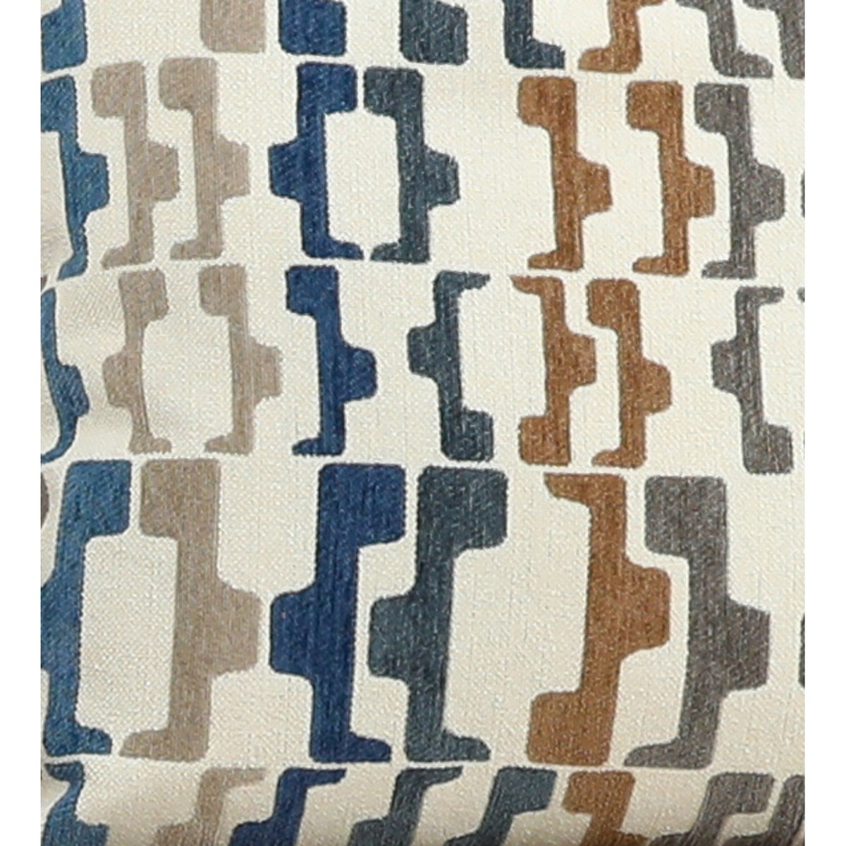 Geometric pillow cover close-up in blue, tan, and white