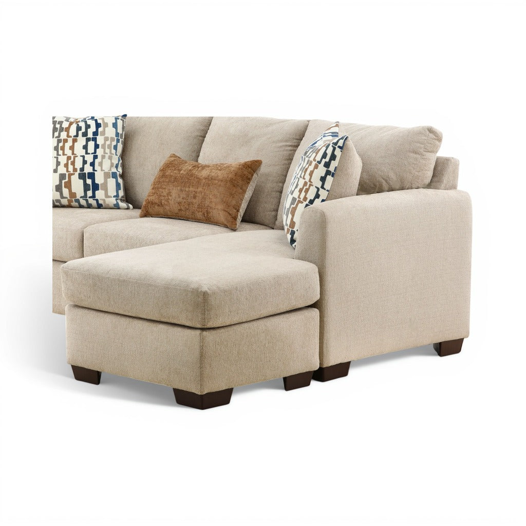 Parchment corner chaise with seat and patterned plus tan accent pillows