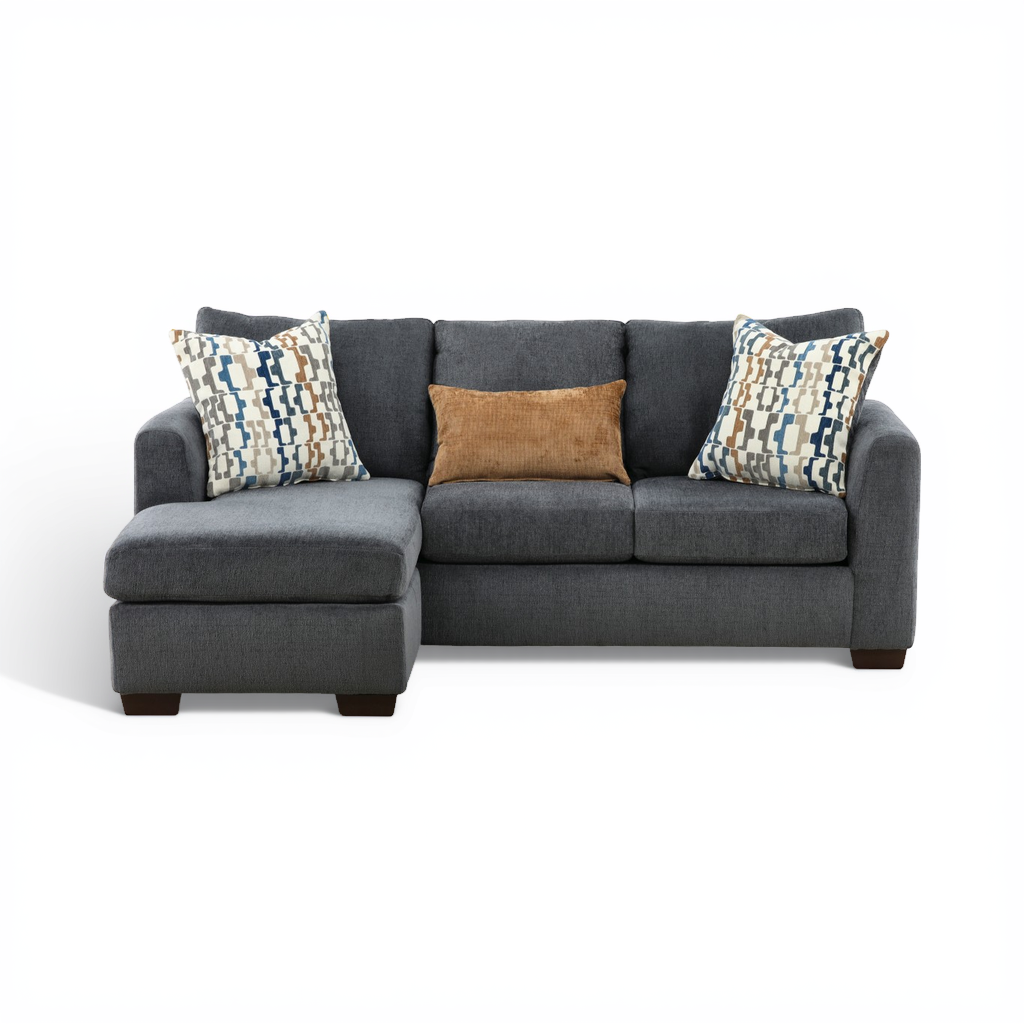 Charcoal sofa chaise with chaise extension and patterned accent pillows.