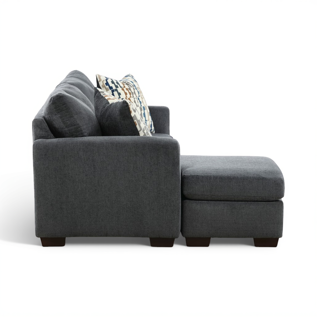 Charcoal sofa chaise with chaise side, textured fabric and accent pillows.