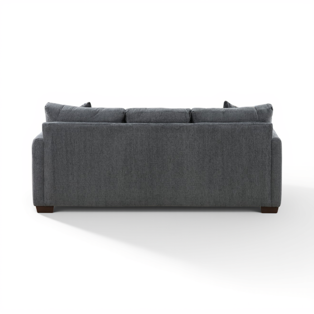 Charcoal sofa chaise from front, three back cushions and dark legs.