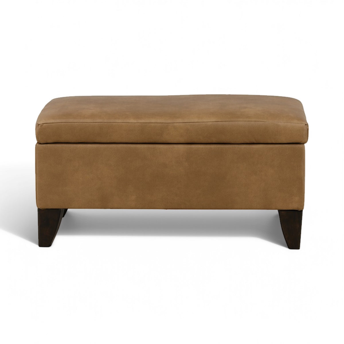 Tan storage ottoman with padded top and dark wooden legs, closed