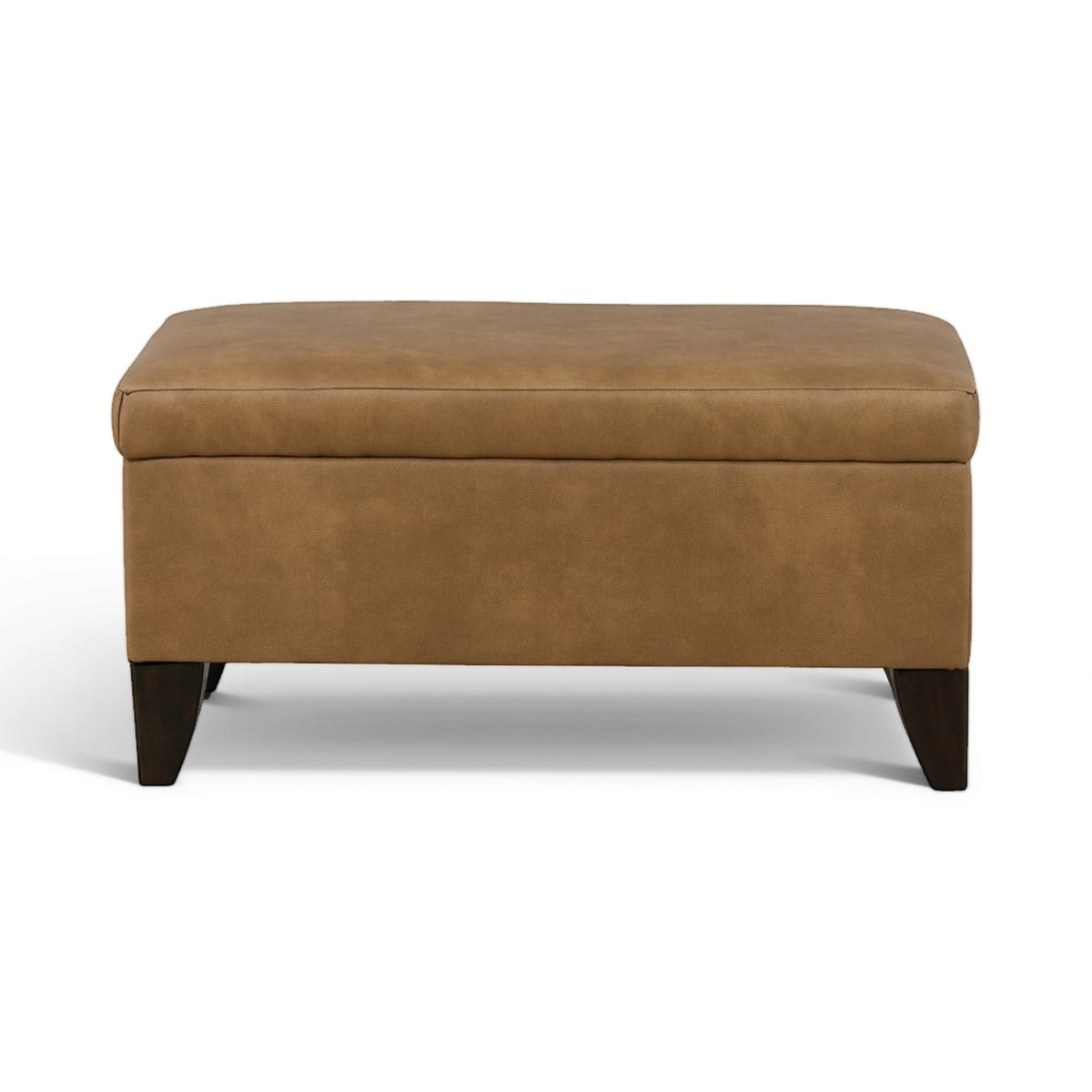 Tan storage ottoman with padded top and hinged lid, dark wooden legs