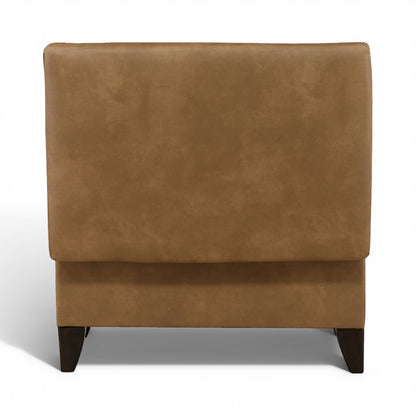 Tan storage ottoman with padded top, hinged lid, and dark wooden legs