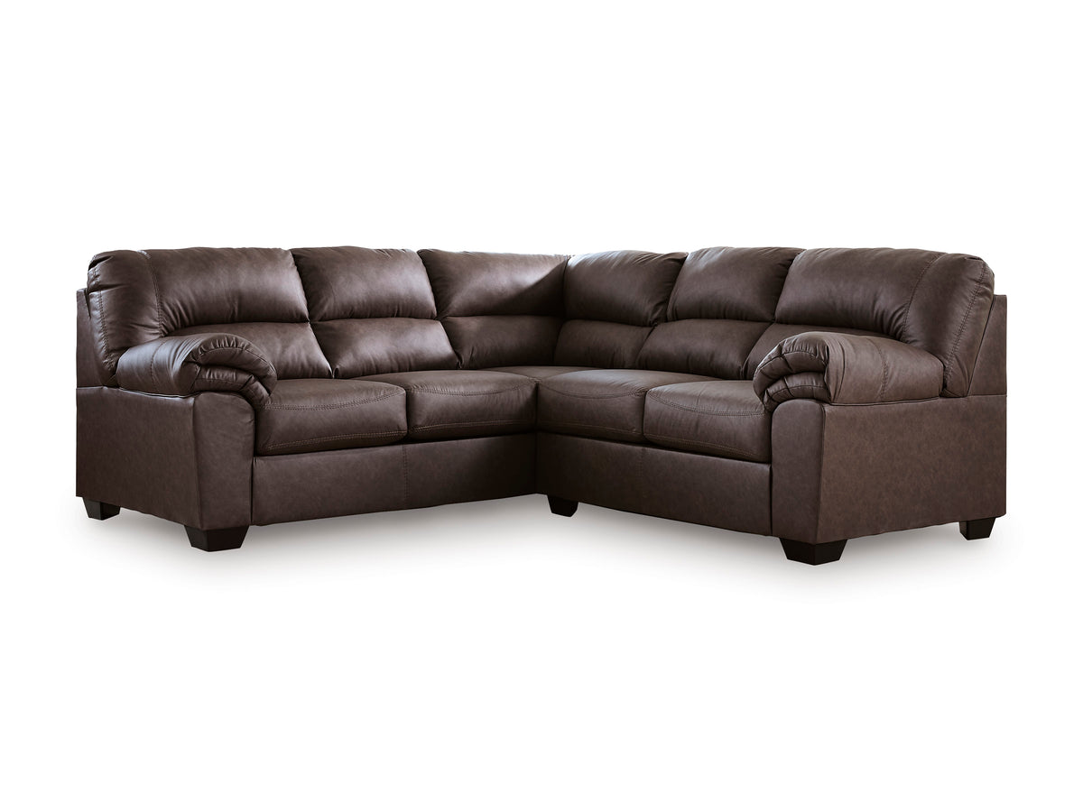 Dark brown left-facing sectional sofa with tufted back, rolled arms, and corner chaise