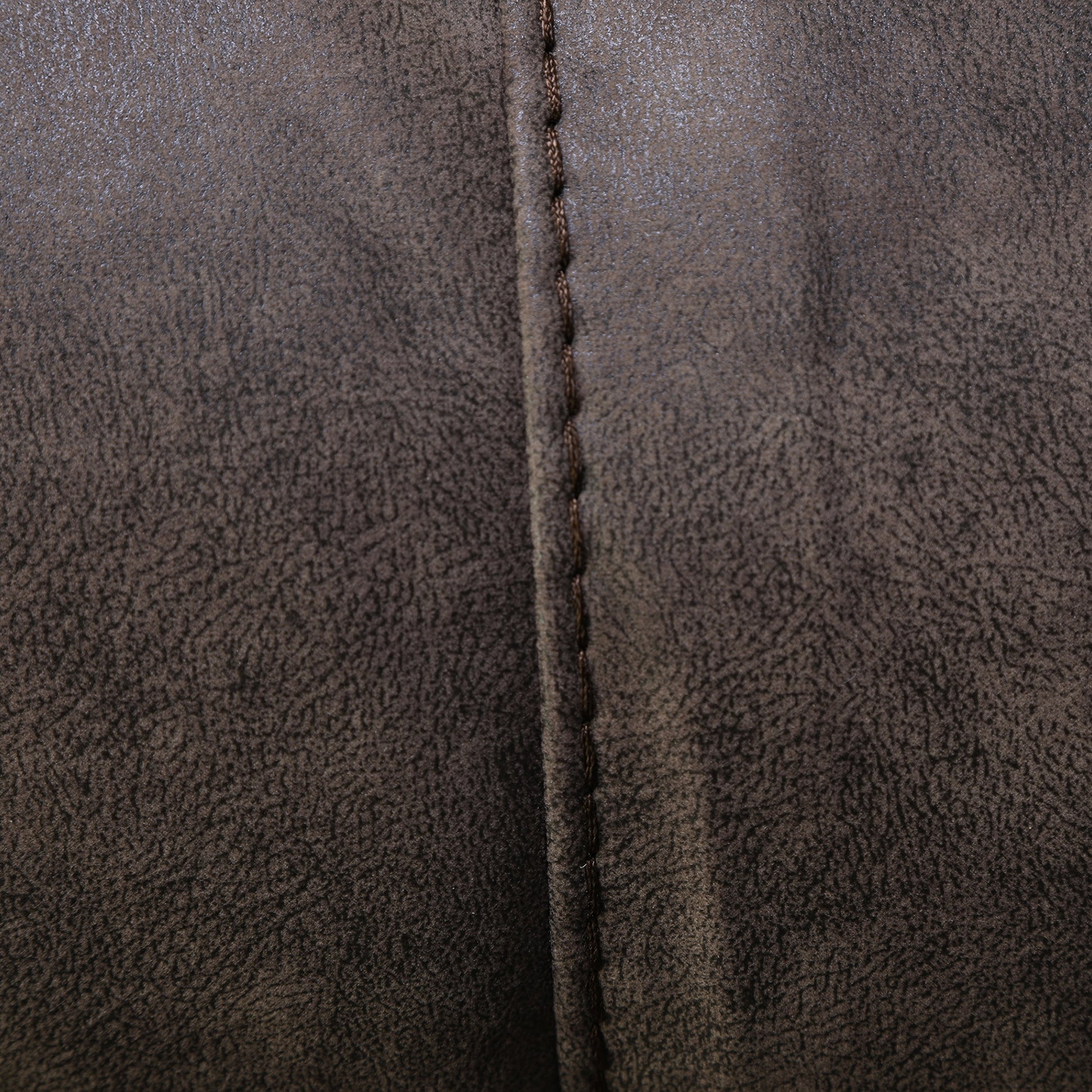Dark brown upholstery with vertical seam and stitched edge detail