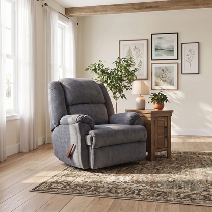 Gray rocker recliner chair with padded arms, tufted back, side control handle