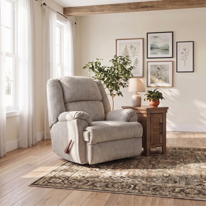 Gray rocker recliner chair with padded arms, tufted back, armrest control handle