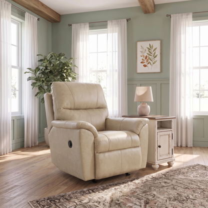 Light beige leather rocker recliner with padded arms, plush back, and side control lever.