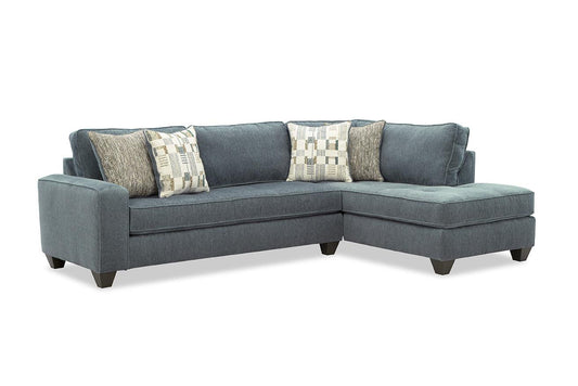 Dark gray sectional sofa with chaise and patterned throw pillows