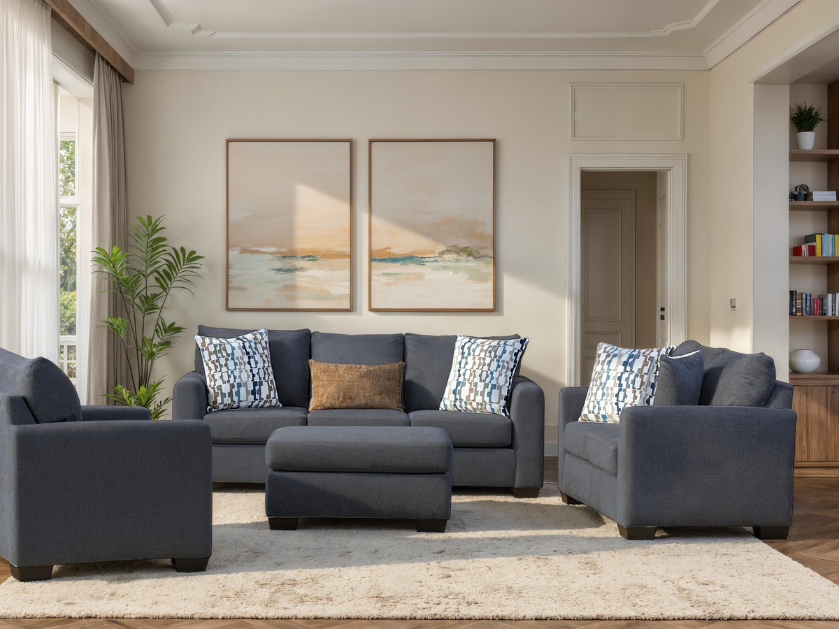 Dark gray fabric sofa with blue patterned and tan accent pillows, with ottoman